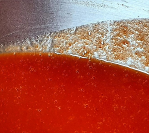 Rosehip puree in a stainless steel bowl